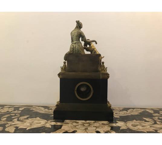 Bronze and marble pendulum in the decor of esmeralda and the period goat 19 th