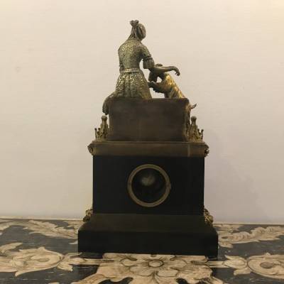 Bronze and marble pendulum in the decor of esmeralda and the period goat 19 th