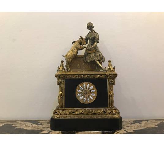 Bronze and marble pendulum in the decor of esmeralda and the period goat 19 th