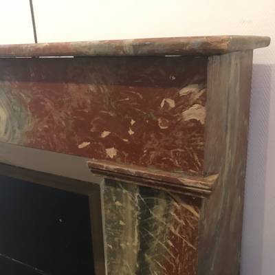 Decor of wood chimney in a fake vintage marble 19th century