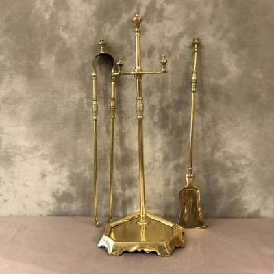Servant of antique fireplace in polished brass of day 19 th