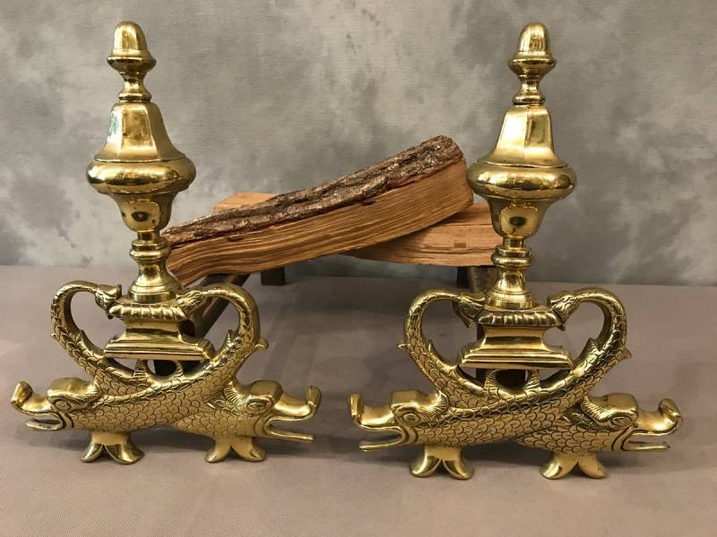 Pair of brass chenets to the 19th-century dolphins