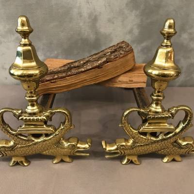 Pair of brass chenets to the 19th-century dolphins