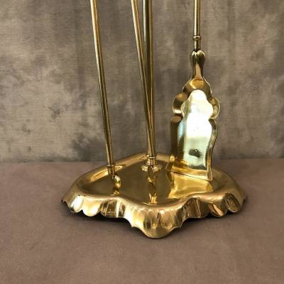 Antique fireplace set in polished brass and varnish from the 19th-century.