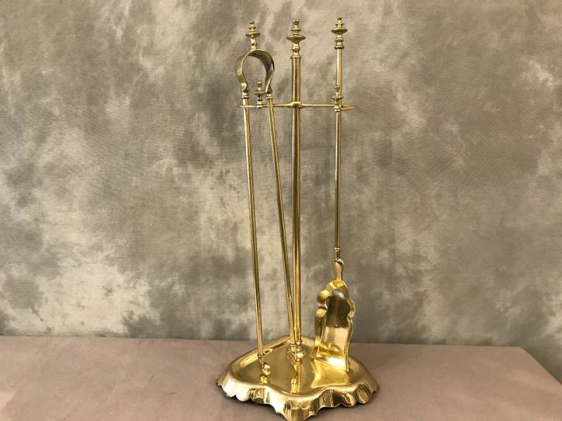 Antique fireplace set in polished brass and varnish from the 19th-century.