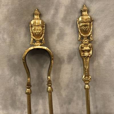 Ensemble d'une pelle et d'une pince de cheminée  en bronze et laiton d'époque 19 ème