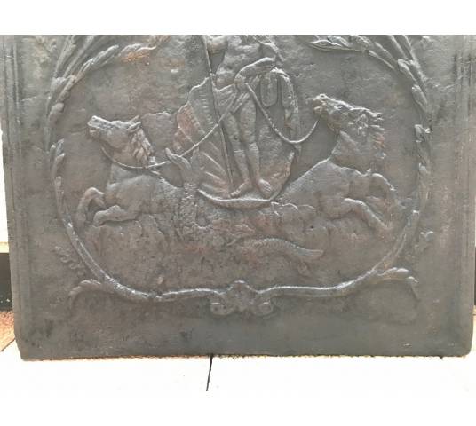 Ancient fireplace insert in late 18th century cast iron