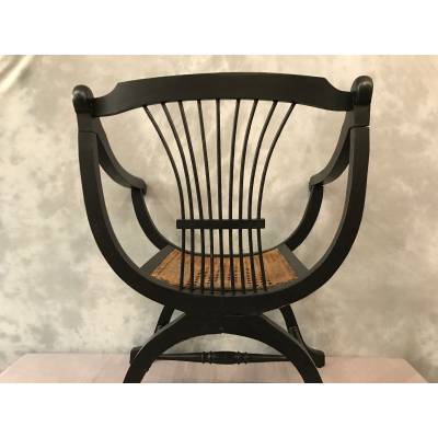 Armchair Dagobert curule in blackened wood around 1900