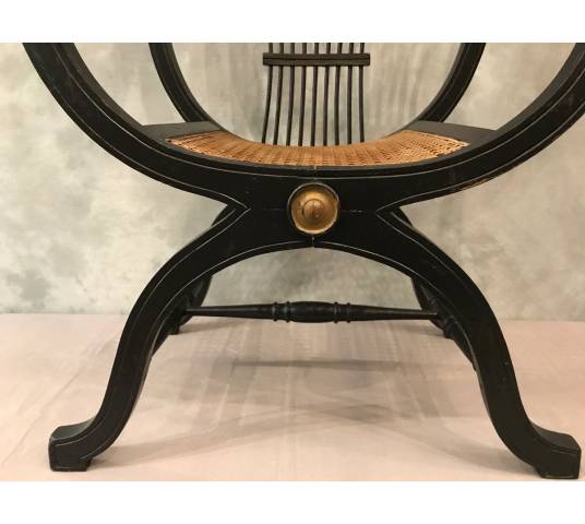 Armchair Dagobert curule in blackened wood around 1900