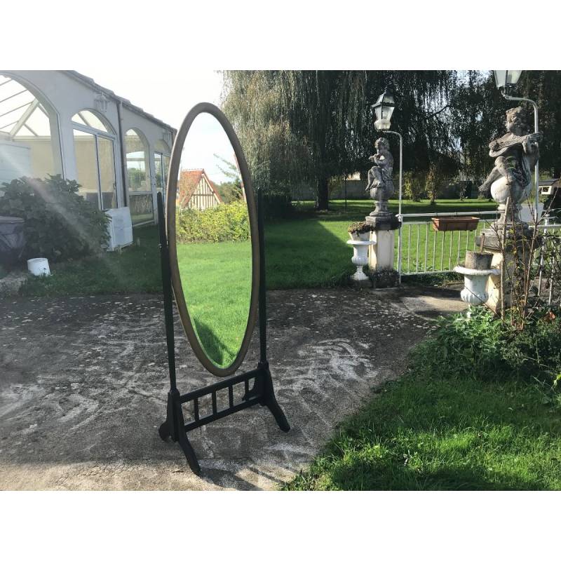 Miroir psyche in blackened wood and gilded wood with a nice oval mirror of epoch Art Deco