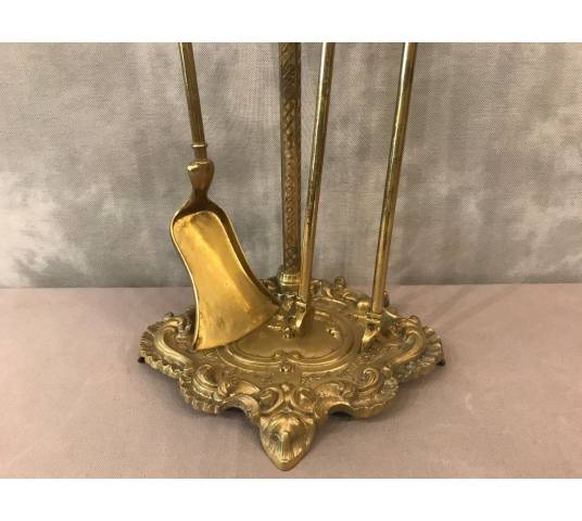 Servant of a fireplace in vintage brass 19 th of the Louis XV style