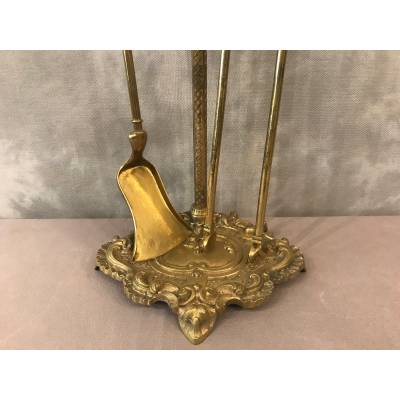 Servant of a fireplace in vintage brass 19 th of the Louis XV style