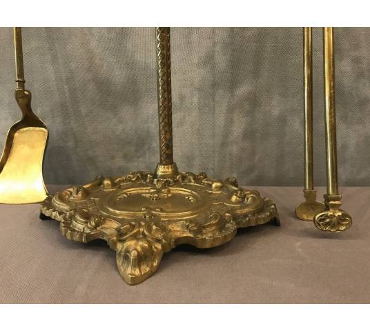 Servant of a fireplace in vintage brass 19 th of the Louis XV style